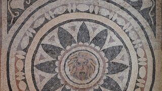 899px-4th_century_AD_Mosaic_with_mask_of_Phobos_(Fear)_within_a_radiating_petal_design,_from_Halicanassus_(Asia_Minor),_British_Museum_(14256569991)
